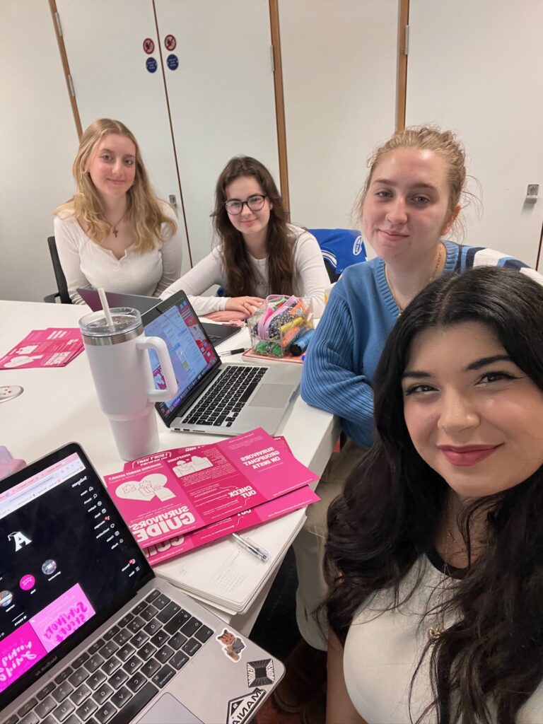 A group of four women posing for a selfie